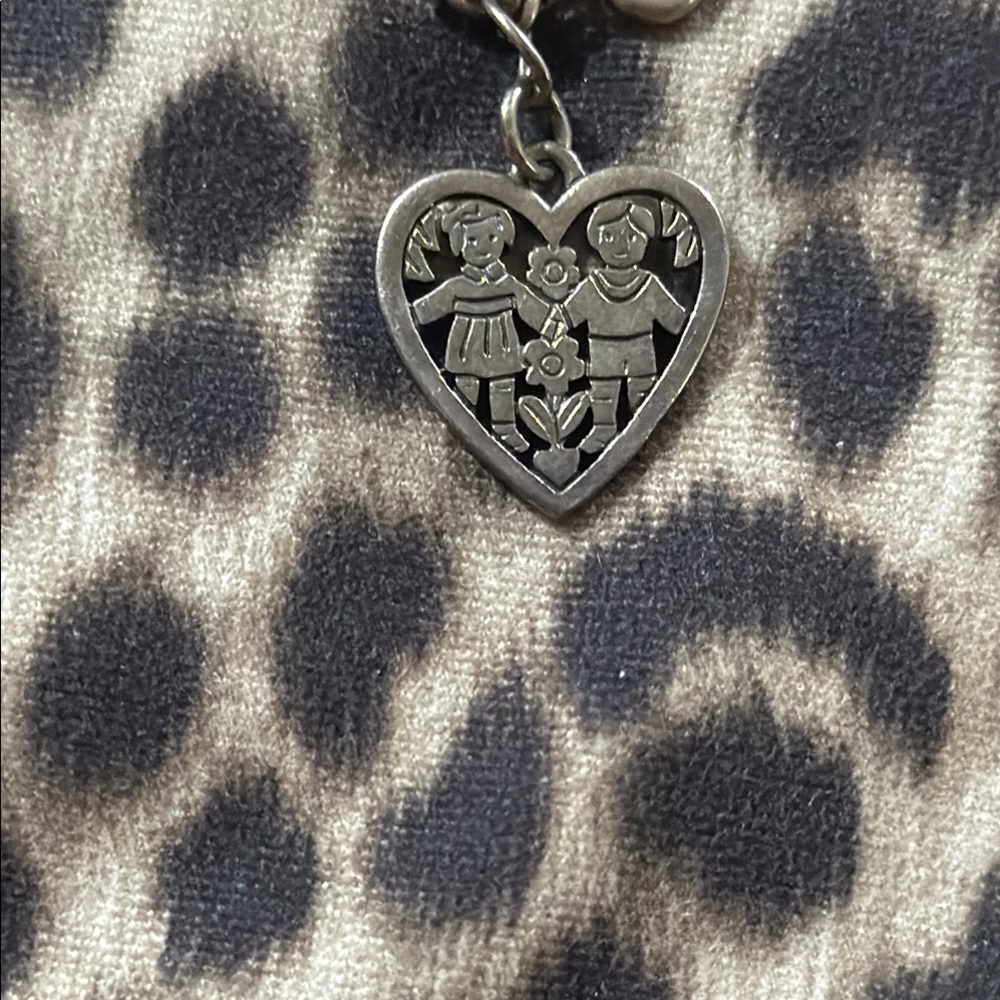 James Avery Heart-Shaped Pendant with Child Design